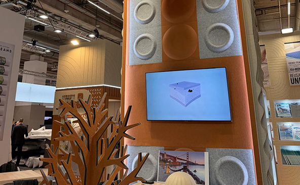 FeltVibe exhibition stand at Heimtextile 2026 Frankfurt featuring 3D Cap round acoustic felt panels, decorative wooden tree sculpture and product presentation screen